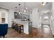Beautiful kitchen view featuring granite countertops, gray cabinets and stainless steel appliances at 55 E American Marigold Dr # 36, Benson, NC 27504