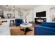 Open-concept living area with hardwood floors, modern decor, and kitchen bar at 55 E American Marigold Dr # 36, Benson, NC 27504