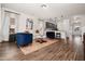Spacious living room with hardwood floors, modern furniture and open kitchen view at 55 E American Marigold Dr # 36, Benson, NC 27504