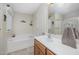 Bright bathroom with a tub, shower and a towel rack at 59 Long Grass Dr, Smithfield, NC 27577