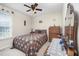 Charming bedroom with a cozy quilt, complemented by classic wooden furniture at 59 Long Grass Dr, Smithfield, NC 27577