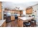 Well-equipped kitchen features granite countertops, stainless appliances, and breakfast bar seating at 59 Long Grass Dr, Smithfield, NC 27577