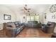 Inviting living room features hardwood floors, vaulted ceiling, and comfortable seating at 59 Long Grass Dr, Smithfield, NC 27577