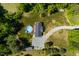 Aerial view of home with above ground pool, shed, gravel driveway, and mature landscaping at 5912 Mt Zion Rd, Snow Camp, NC 27349
