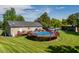 Fenced above-ground pool and green lawn in the backyard make for summer fun! at 5912 Mt Zion Rd, Snow Camp, NC 27349