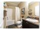 Functional bathroom with a shower-tub combo, vanity sink, and coordinated decor at 5912 Mt Zion Rd, Snow Camp, NC 27349
