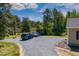 Spacious gravel parking area beside home and open-sided storage shed at 5912 Mt Zion Rd, Snow Camp, NC 27349