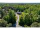 Beautiful single-story home with a long driveway surrounded by mature trees at 5912 Mt Zion Rd, Snow Camp, NC 27349