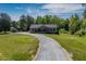 Lovely one-story home set back on a large lot with a long gravel driveway at 5912 Mt Zion Rd, Snow Camp, NC 27349