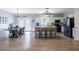 Spacious kitchen features island, white cabinets, stainless appliances, and luxury vinyl floors at 5912 Mt Zion Rd, Snow Camp, NC 27349
