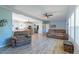 Open-concept with vinyl floors, comfortable seating, and view into the eat-in kitchen at 5912 Mt Zion Rd, Snow Camp, NC 27349