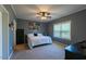 Comfortable primary bedroom offers a ceiling fan and natural light at 5912 Mt Zion Rd, Snow Camp, NC 27349