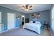 Comfortable primary bedroom offers neutral paint and an ensuite bathroom at 5912 Mt Zion Rd, Snow Camp, NC 27349