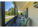 Comfortable covered porch with rocking chairs, ideal for relaxing and enjoying the view at 5912 Mt Zion Rd, Snow Camp, NC 27349