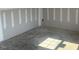 Unfinished basement room with concrete floor and light gray walls at 6828 Galloway Dr, Middlesex, NC 27557