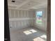 Bedroom with drywall, and a window bringing in natural light, ready for customization and finishing at 6828 Galloway Dr, Middlesex, NC 27557