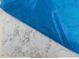 Close-up of the white countertop with grey veins protected with blue plastic wrap at 6828 Galloway Dr, Middlesex, NC 27557