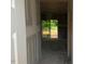 View of an unfinished entryway leading to a room with sliding glass doors at 6828 Galloway Dr, Middlesex, NC 27557