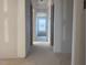 Unfinished hallway with drywall, framing showing doorway, ready for customization and finishing at 6828 Galloway Dr, Middlesex, NC 27557