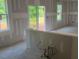 Unfinished living room with lots of natural light coming from the windows at 6828 Galloway Dr, Middlesex, NC 27557