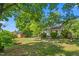 Private backyard featuring a shed, fire pit, and covered patio at 701 Veterans Dr, Elon, NC 27244