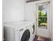 Practical laundry room with washer, dryer, and access to the outdoors at 701 Veterans Dr, Elon, NC 27244
