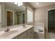 Well-lit bathroom featuring a double vanity, soaking tub, and tile flooring at 716 Lakeview Ave, Wake Forest, NC 27587
