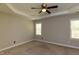 Cozy bedroom with ceiling fan, large windows and carpet flooring at 716 Lakeview Ave, Wake Forest, NC 27587