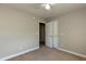 Bedroom with ceiling fan, neutral walls, and closet access provides a soothing and practical space at 716 Lakeview Ave, Wake Forest, NC 27587