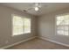 A cozy bedroom features two windows, bringing in natural light and offering a comfortable retreat at 716 Lakeview Ave, Wake Forest, NC 27587