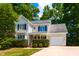 Charming two-story home with landscaped yard and attached one car garage at 716 Lakeview Ave, Wake Forest, NC 27587