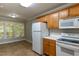 Well-lit kitchen area with oak cabinets, and modern appliances at 716 Lakeview Ave, Wake Forest, NC 27587