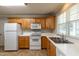 Functional kitchen with white appliances, oak cabinets and ample counter space at 716 Lakeview Ave, Wake Forest, NC 27587