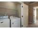 Laundry room with washer, dryer, and convenient access to the rest of the home at 716 Lakeview Ave, Wake Forest, NC 27587