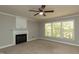 Comfortable bedroom featuring a ceiling fan, fireplace, and generous natural light at 716 Lakeview Ave, Wake Forest, NC 27587