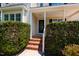 Front porch with brick steps and black door in a well-maintained home at 716 Lakeview Ave, Wake Forest, NC 27587