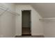 A walk-in closet with built-in shelving offers ample storage and organization options at 716 Lakeview Ave, Wake Forest, NC 27587