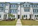 Attractive townhome exterior with well-kept lawn, manicured shrubs, and a welcoming entrance at 805 Hyperion Aly, Wake Forest, NC 27587