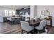 Open-concept space with modern kitchen flowing into dining room with seating for six at 806 Hillfarm Dr, Wake Forest, NC 27587