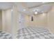Open basement area with checkered floors, closet, and recessed lighting at 823 Churchill Dr, Chapel Hill, NC 27517