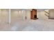 Expansive basement featuring a cozy fireplace and stairs to upper levels at 823 Churchill Dr, Chapel Hill, NC 27517