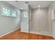 Bright bathroom showcasing a seamless glass shower and tile surround, accented by natural light at 823 Churchill Dr, Chapel Hill, NC 27517