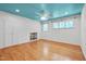 Bedroom featuring custom ceiling, built-in shelving, ample natural light, and hardwood floors at 823 Churchill Dr, Chapel Hill, NC 27517