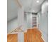 Spacious walk-in closet with custom shelving and hardwood floors at 823 Churchill Dr, Chapel Hill, NC 27517