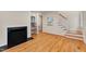 Entryway with a fireplace, staircase, and desk nook, showcasing natural light and hardwood floors at 823 Churchill Dr, Chapel Hill, NC 27517