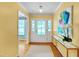 Bright foyer featuring hardwood floors, stylish console table, and access to a spacious living area at 823 Churchill Dr, Chapel Hill, NC 27517