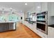 Open concept kitchen with modern appliances and seamless flow to the living area at 823 Churchill Dr, Chapel Hill, NC 27517