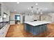 Spacious kitchen with island, stainless appliances, and an adjacent dining area at 823 Churchill Dr, Chapel Hill, NC 27517