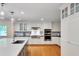 Well-equipped kitchen with stainless steel appliances and custom white cabinetry at 823 Churchill Dr, Chapel Hill, NC 27517