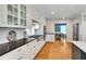Modern kitchen with stainless steel appliances and white shaker cabinetry at 823 Churchill Dr, Chapel Hill, NC 27517